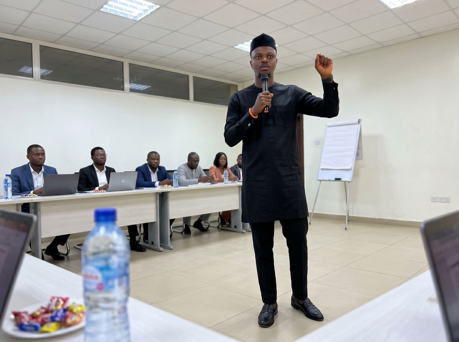Olamilekan E. Wealth teaching a room of professionals in Lagos